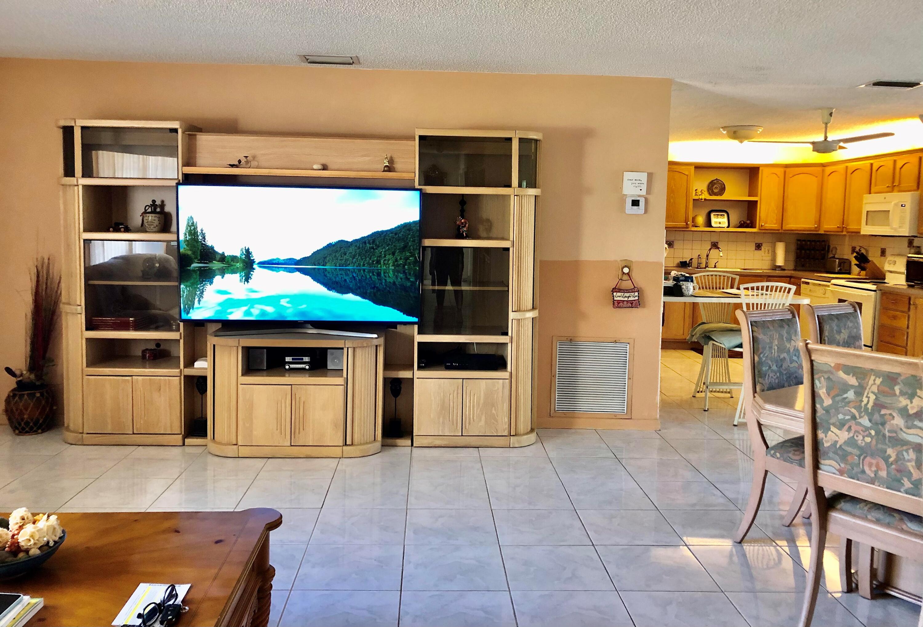 4535 Baldric Street Boca Raton, FL 33428 - Photo 3 of 19 a kitchen with stainless steel appliances kitchen island granite countertop a refrigerator and a stove