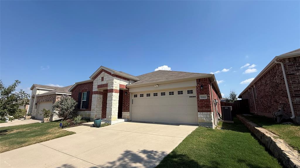 3312 Biggs Avenue Aubrey, TX 76227 - Photo 2 of 19 a front view of a house with a yard
