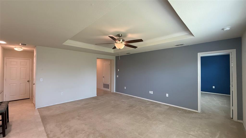 3312 Biggs Avenue Aubrey, TX 76227 - Photo 7 of 19 a view of an empty room with a ceiling fan