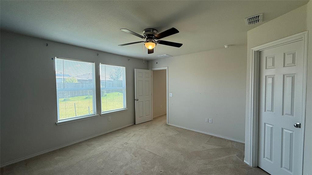 3312 Biggs Avenue Aubrey, TX 76227 - Photo 9 of 19 a view of an empty room with a window
