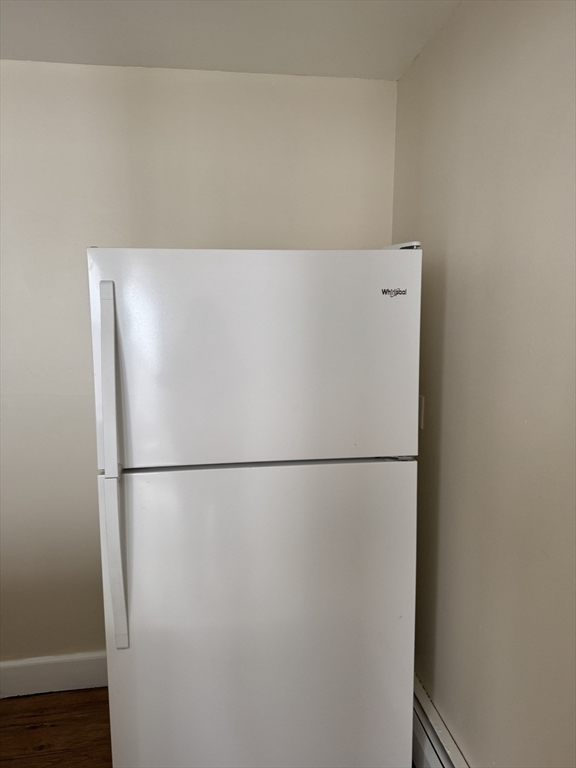 31 Moreland Street, Unit 2 Boston, MA 02119 - Photo 2 of 9 a white refrigerator freezer sitting in a kitchen