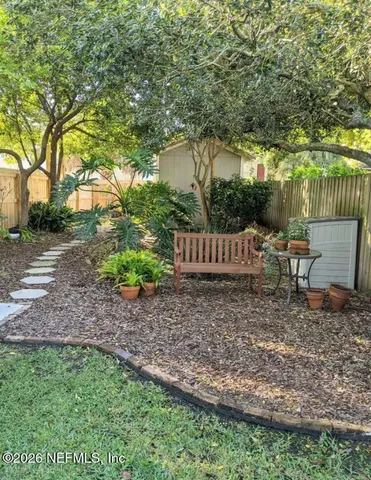 a garden view with a seating space