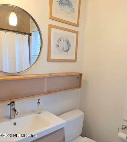 a bathroom with a toilet and a sink