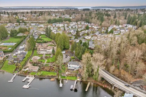 an aerial view of residential house with parking