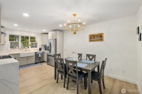 a view of a dining room with furniture window and outside view