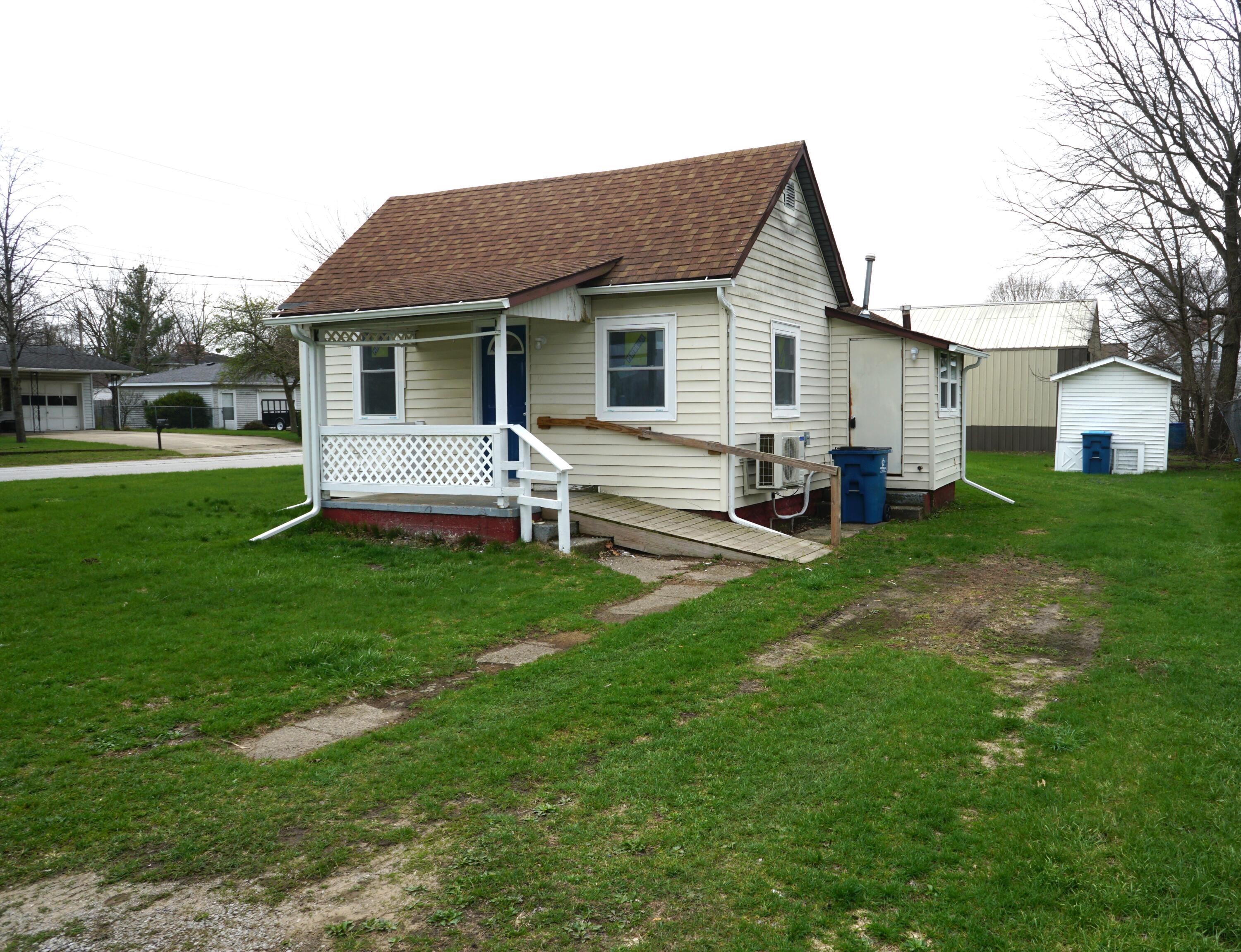 307 South East Street Knox, IN 46534 - Photo 1 of 15 a front view of house with a garden and patio
