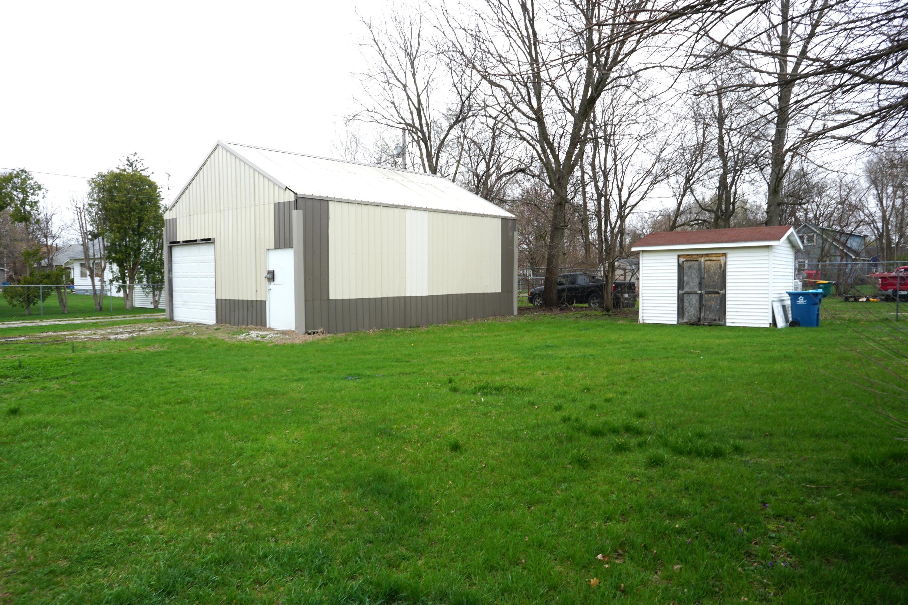 307 South East Street Knox, IN 46534 - Photo 14 of 15 a view of a house with a yard and large trees