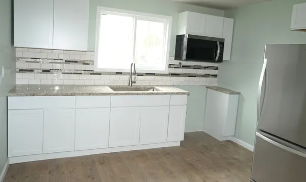 a bathroom with a sink toilet and bathtub