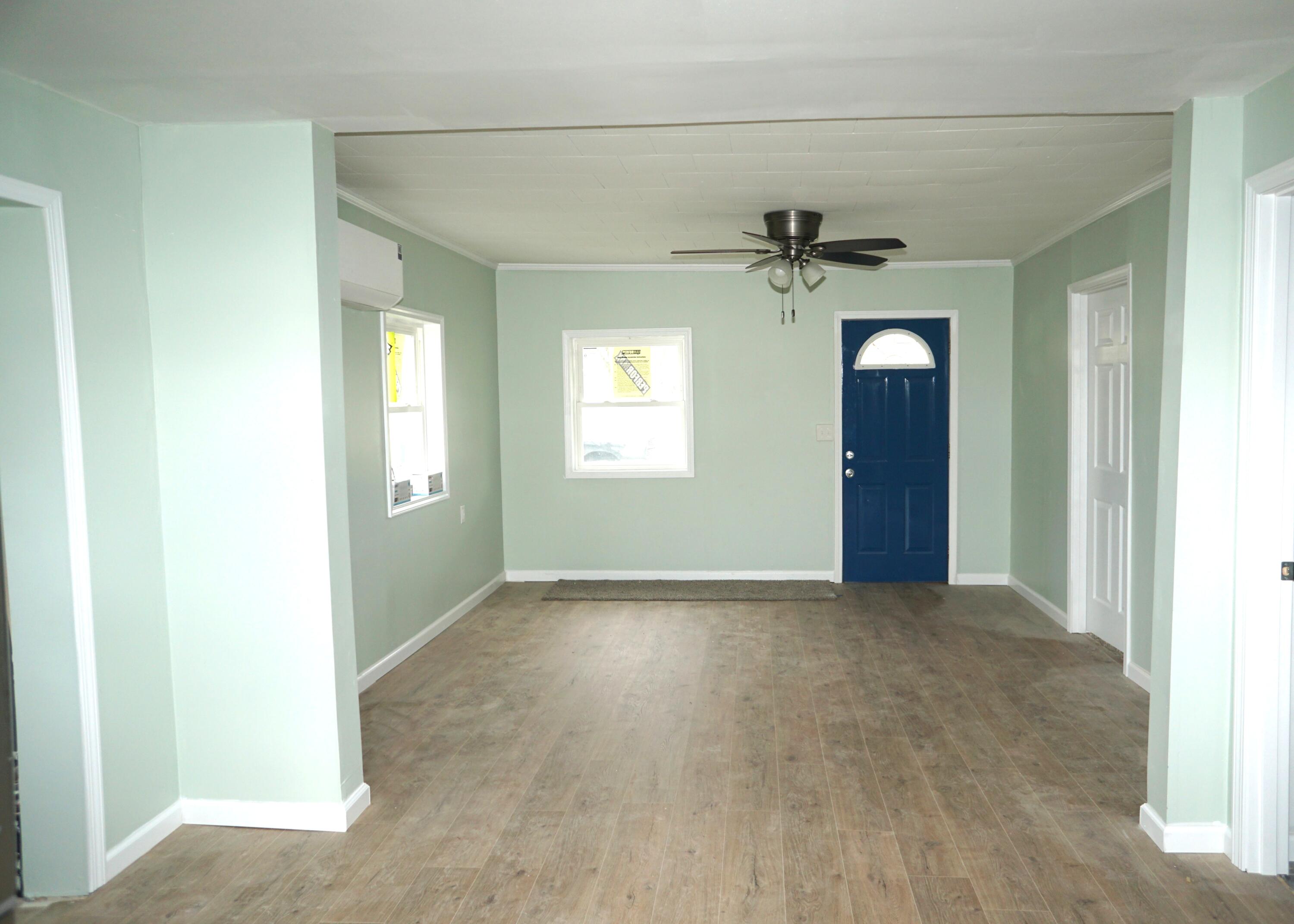 307 South East Street Knox, IN 46534 - Photo 9 of 15 an empty room that has a window and a ceiling fan