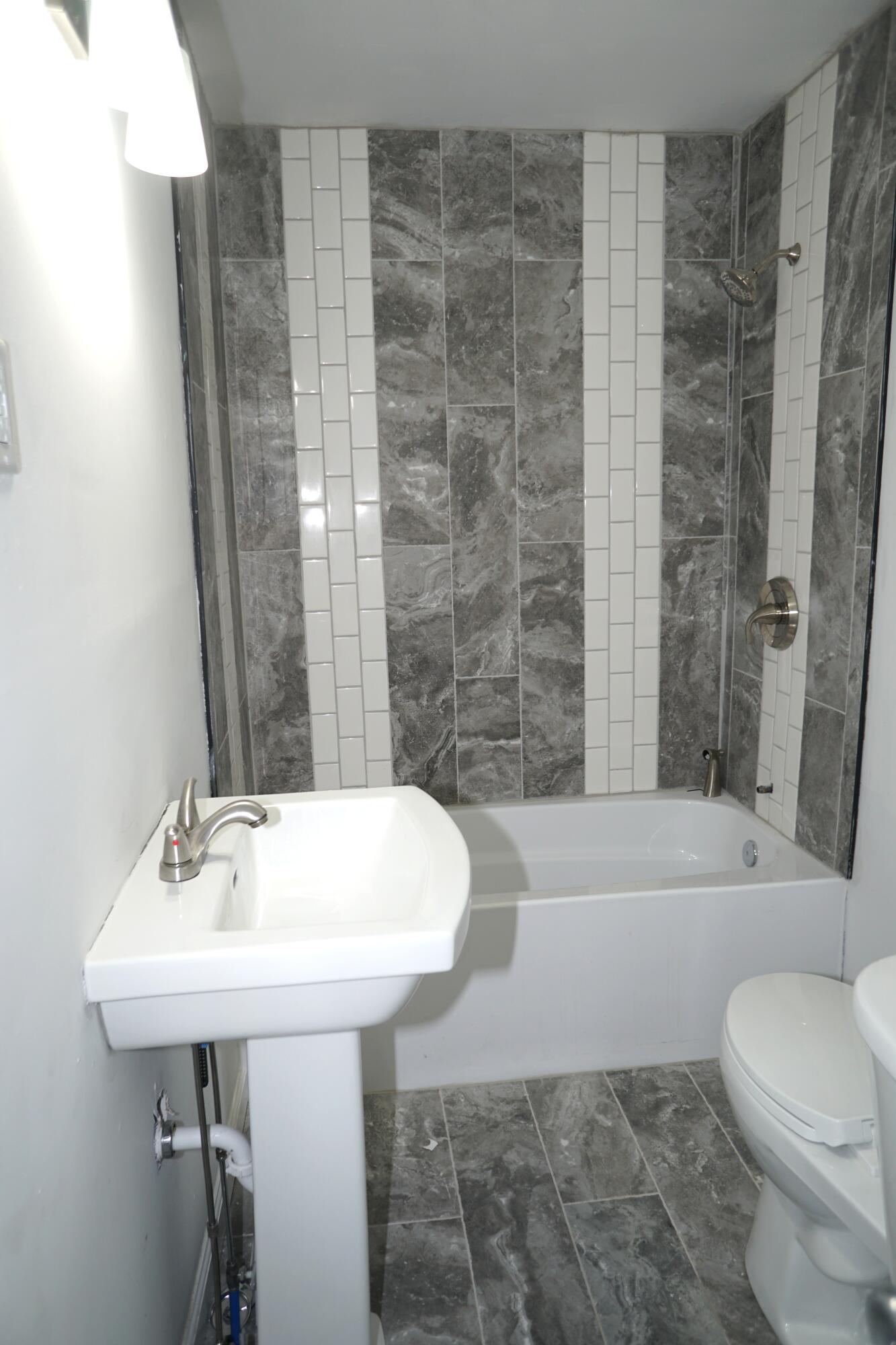 307 South East Street Knox, IN 46534 - Photo 10 of 15 a bathroom with a sink toilet and bathtub