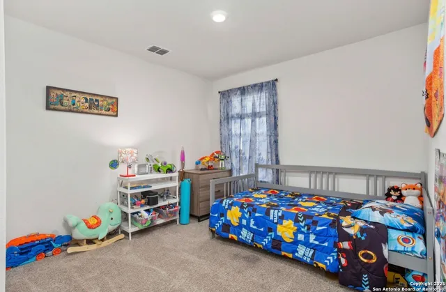 a bedroom with toys and a baby crib