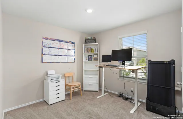 a kitchen with a refrigerator a stove and a microwave