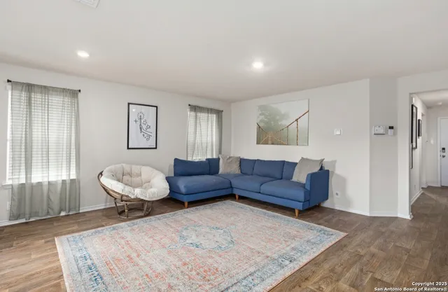 a living room with furniture and a couch