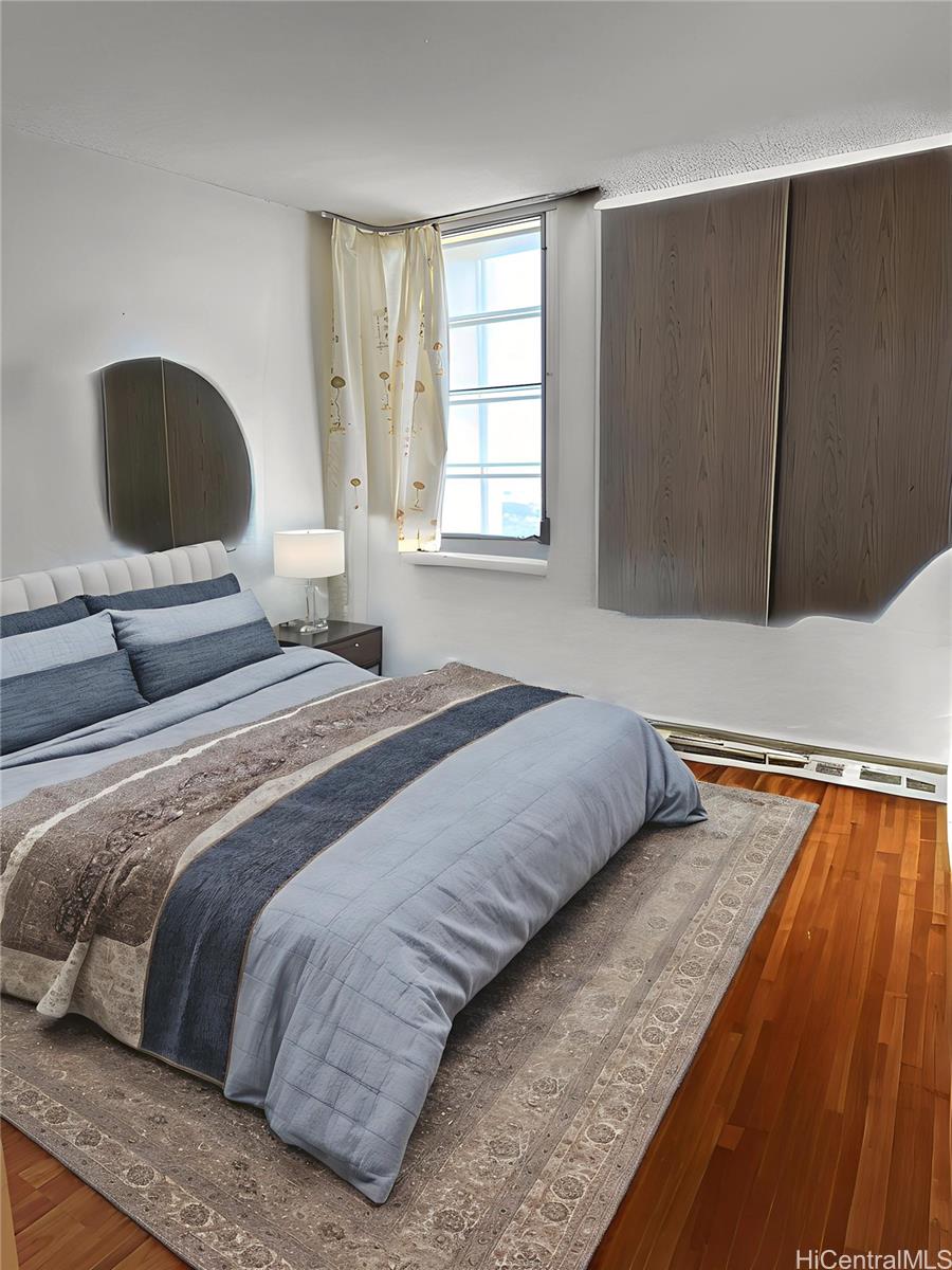 3161 Ala Ilima Street, Unit 1907 Honolulu, HI 96818 - Photo 6 of 12 a bedroom with a bed lamp and window