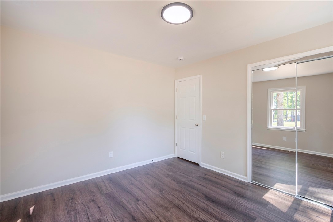 113 Linda Lane Honea Path, SC 29654 - Photo 26 of 36 This inviting bedroom features rich hardwood flooring and ample natural light.