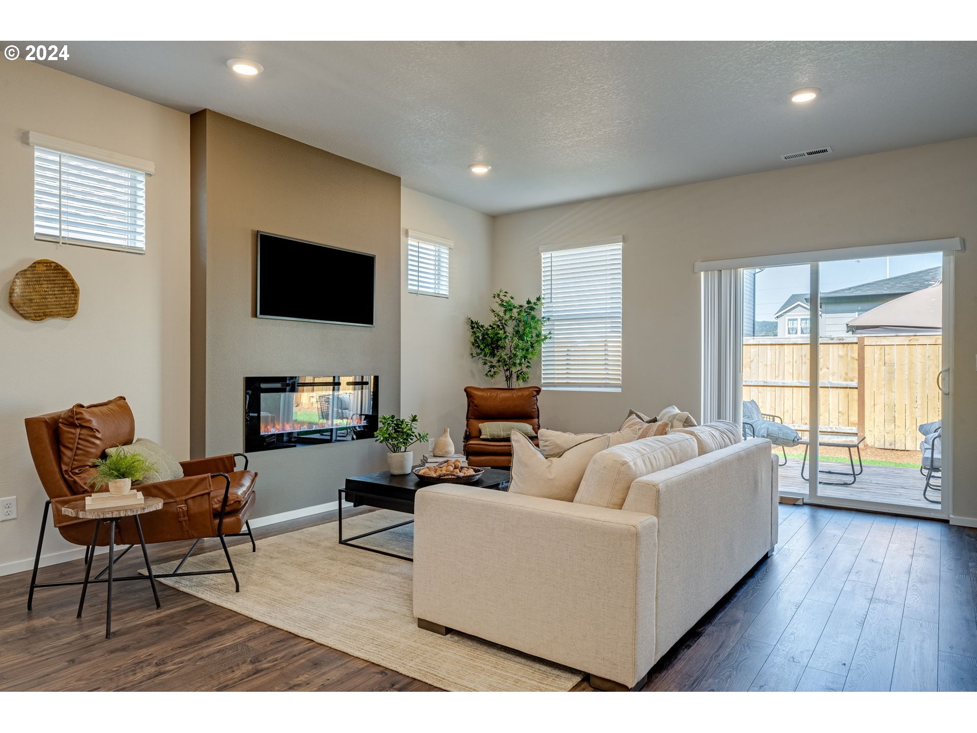 2760 U Street Springfield, OR 97477 - Photo 12 of 48 a living room with furniture and a flat screen tv