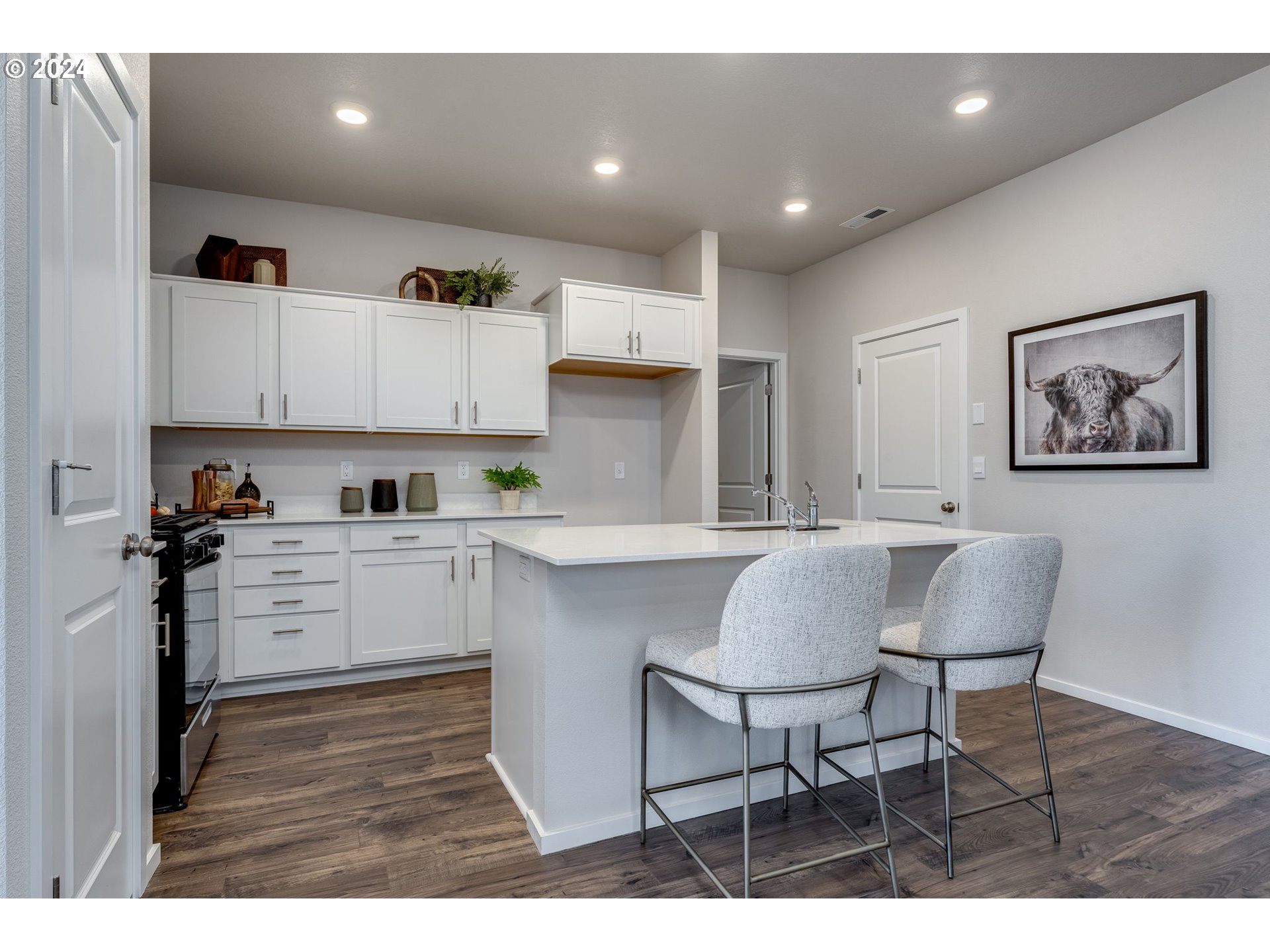 2760 U Street Springfield, OR 97477 - Photo 17 of 48 a kitchen with a dining table cabinets and stainless steel appliances