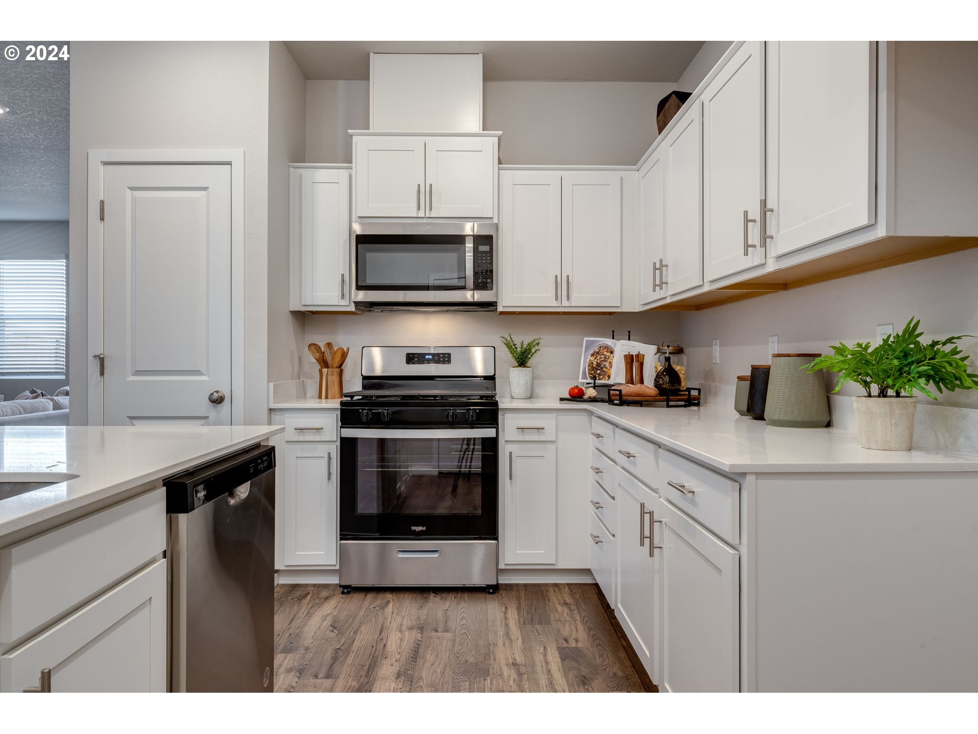2760 U Street Springfield, OR 97477 - Photo 20 of 48 a kitchen with stainless steel appliances granite countertop a sink a stove a microwave and cabinets