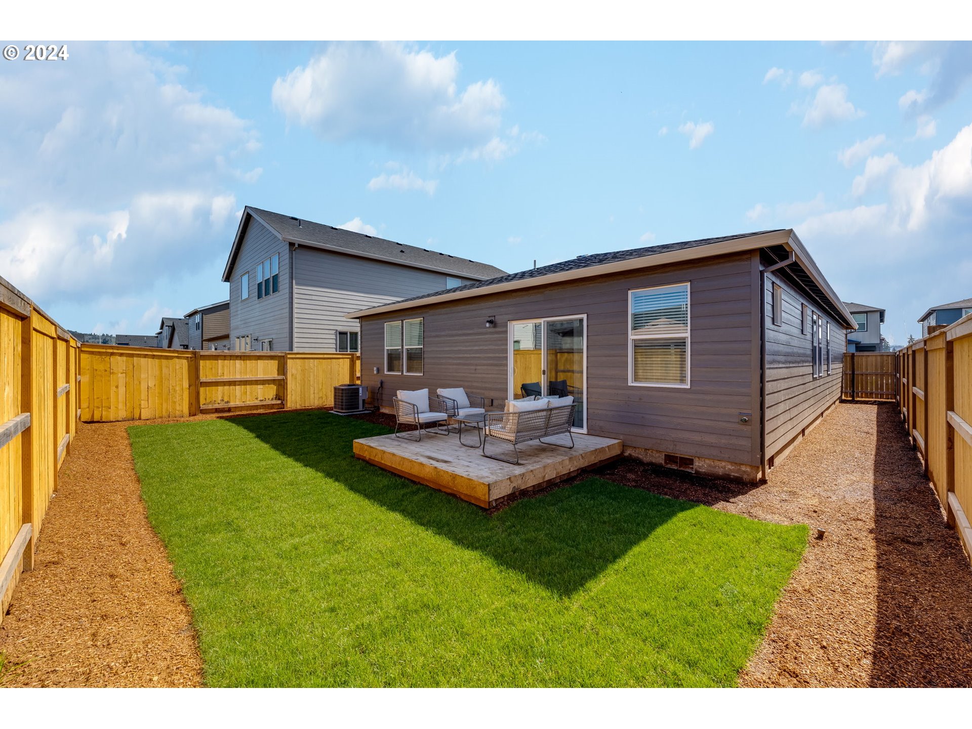 2760 U Street Springfield, OR 97477 - Photo 40 of 48 a front view of a house with a yard table and chairs