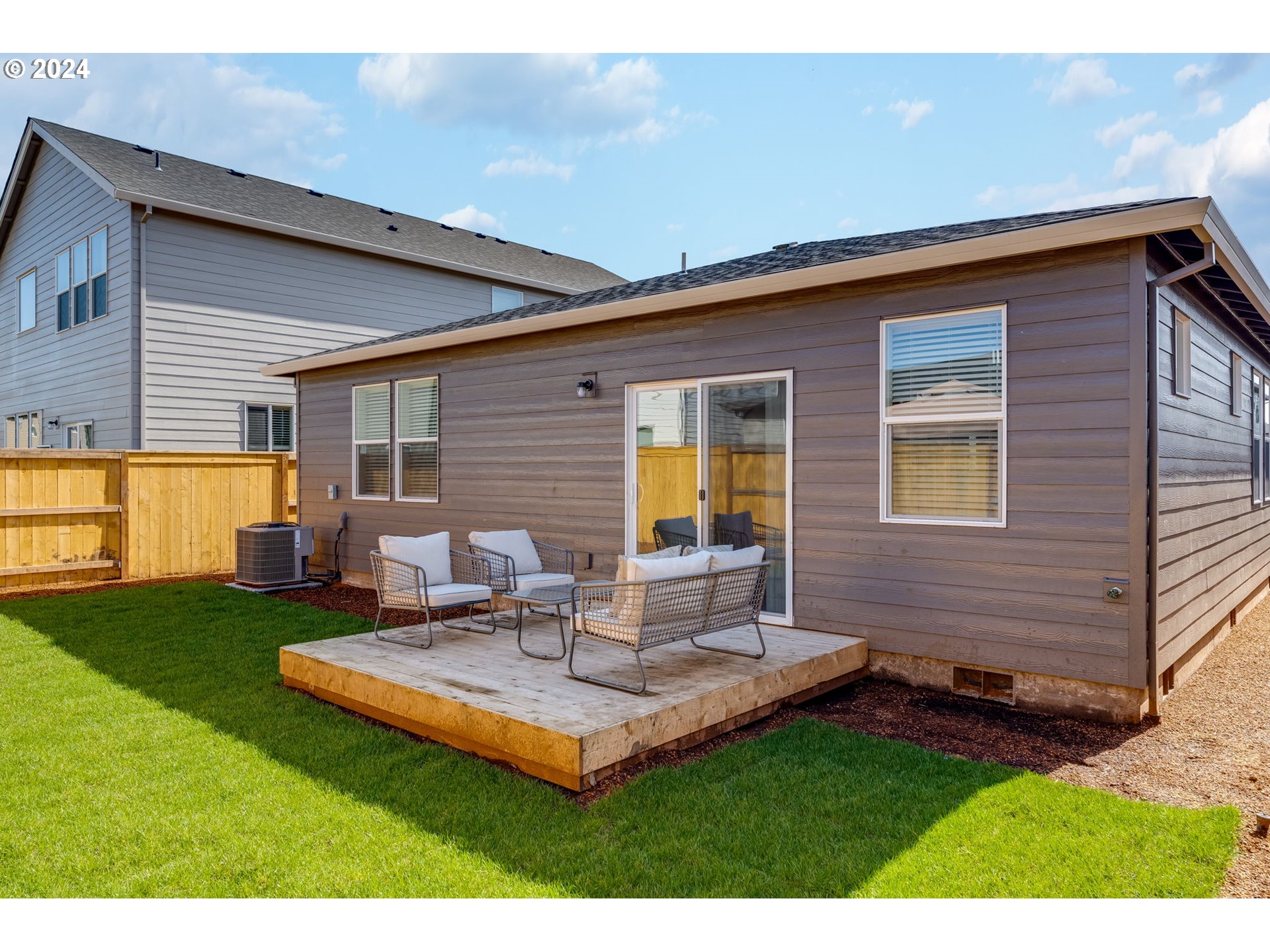 2760 U Street Springfield, OR 97477 - Photo 41 of 48 a backyard of a house with table and chairs