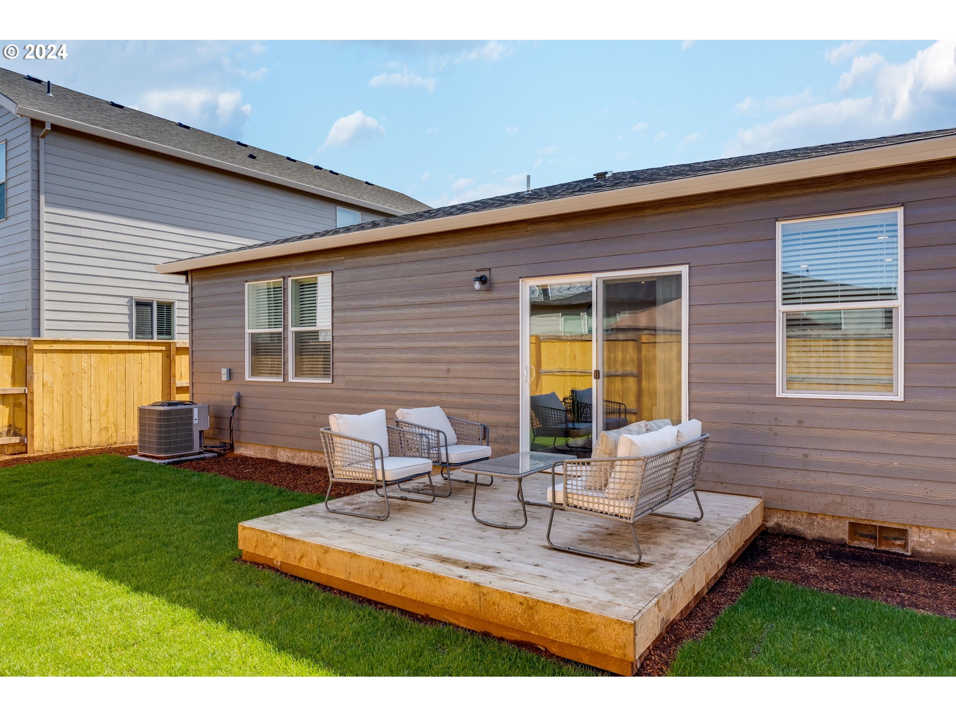 2760 U Street Springfield, OR 97477 - Photo 42 of 48 a view of a backyard with table and chairs and a barbeque