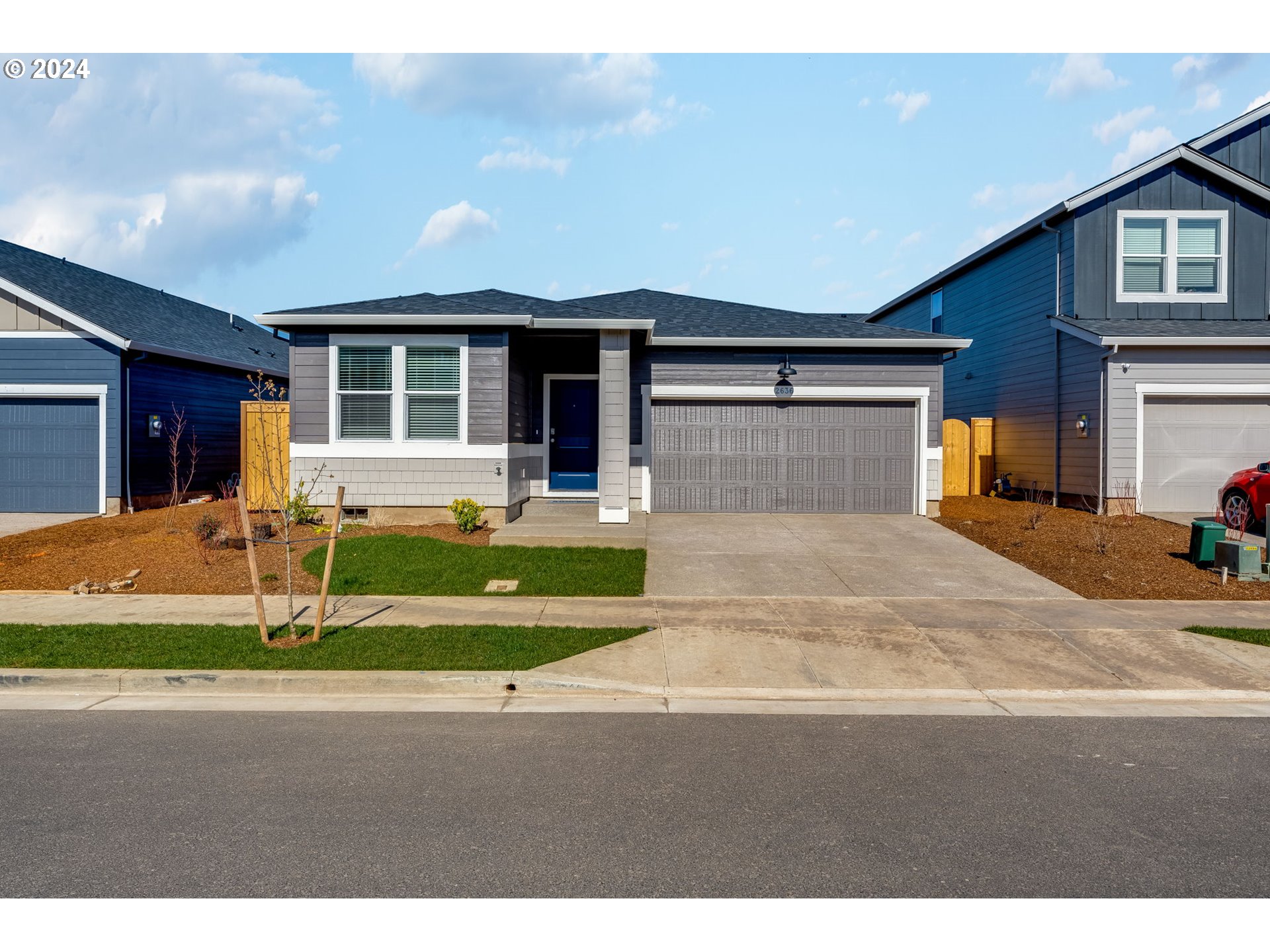 2760 U Street Springfield, OR 97477 - Photo 43 of 48 a front view of a house with a yard and garage