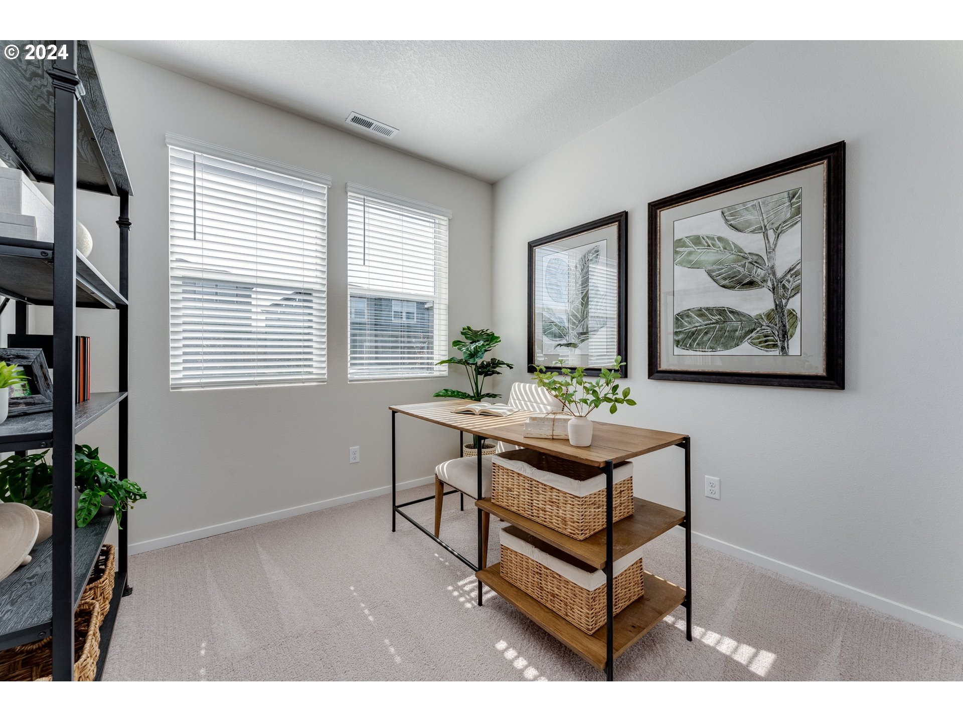 2760 U Street Springfield, OR 97477 - Photo 5 of 48 a view of a workspace with furniture and a potted plant