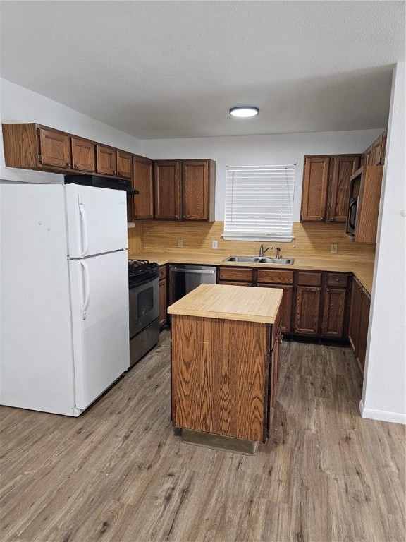 4813 Shadowbend Drive Corpus Christi, TX 78413 - Photo 4 of 12 a kitchen with a sink a counter top space and cabinets