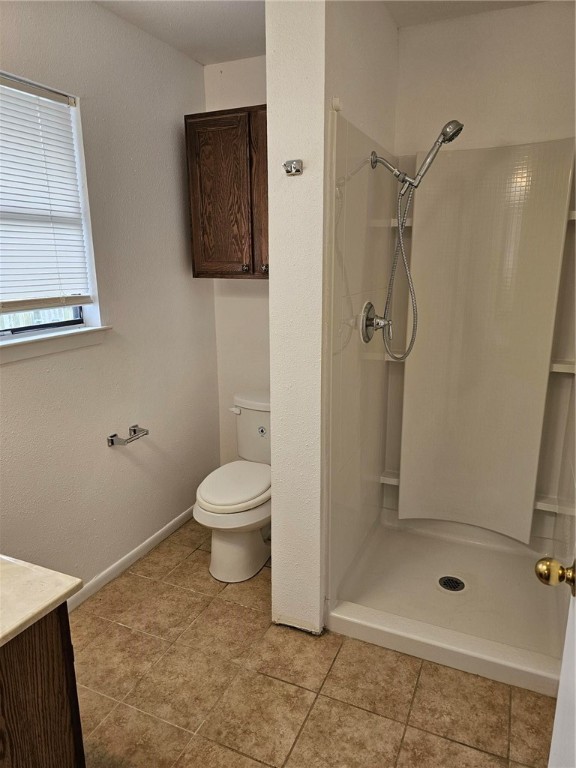 4813 Shadowbend Drive Corpus Christi, TX 78413 - Photo 9 of 12 a bathroom with a toilet and a shower