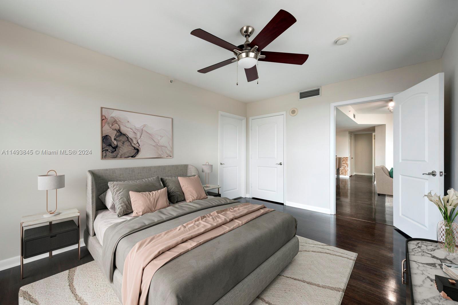 7355 Southwest 89th Street, Unit 510N Miami, FL 33156 - Photo 14 of 52 a bedroom with a large bed and a chandelier