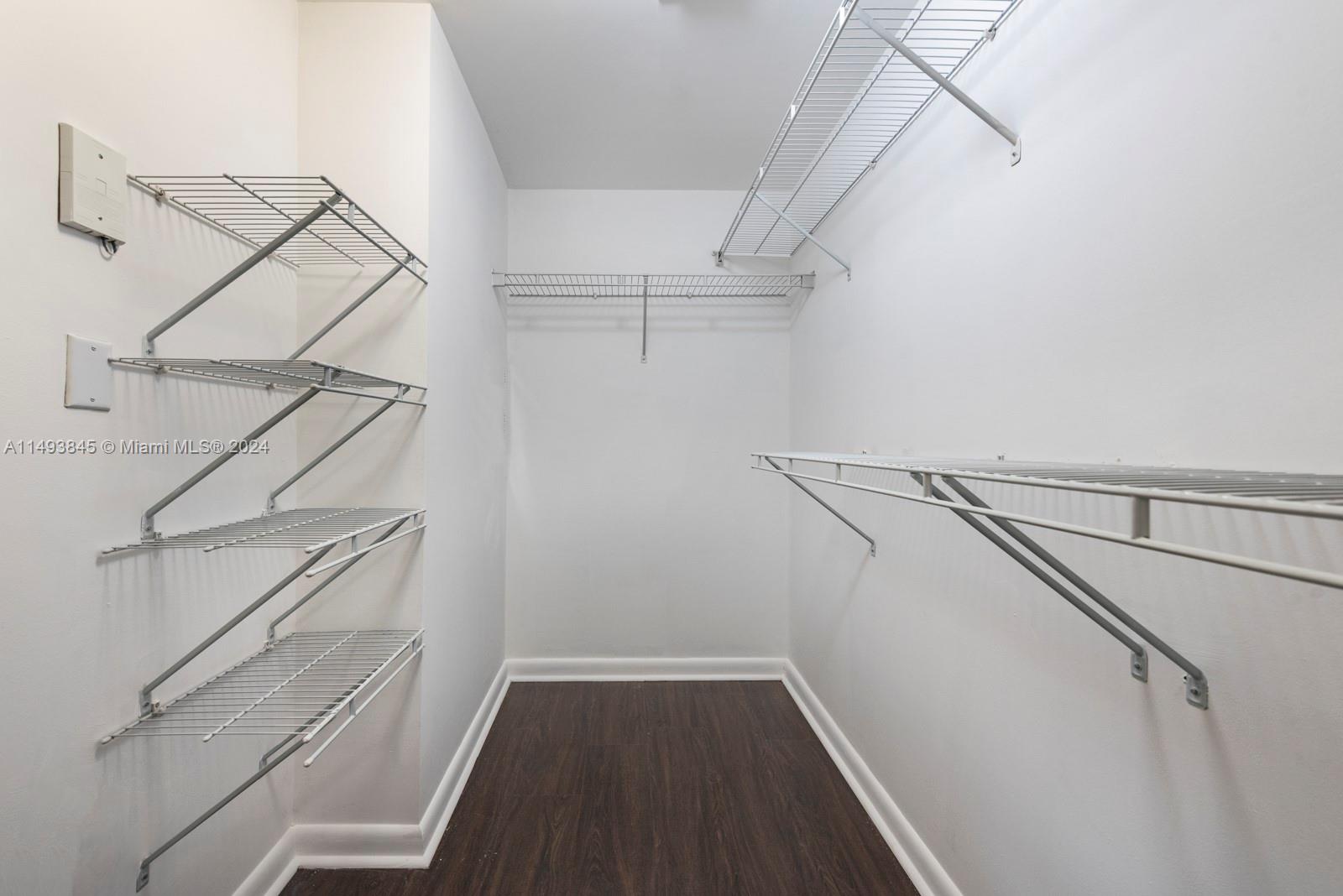 7355 Southwest 89th Street, Unit 510N Miami, FL 33156 - Photo 20 of 52 a view of walk in closet with empty racks