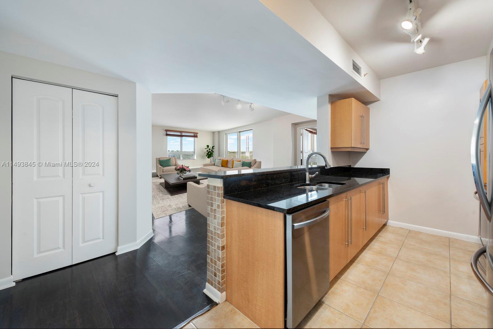 7355 Southwest 89th Street, Unit 510N Miami, FL 33156 - Photo 2 of 52 a kitchen with a sink and cabinets