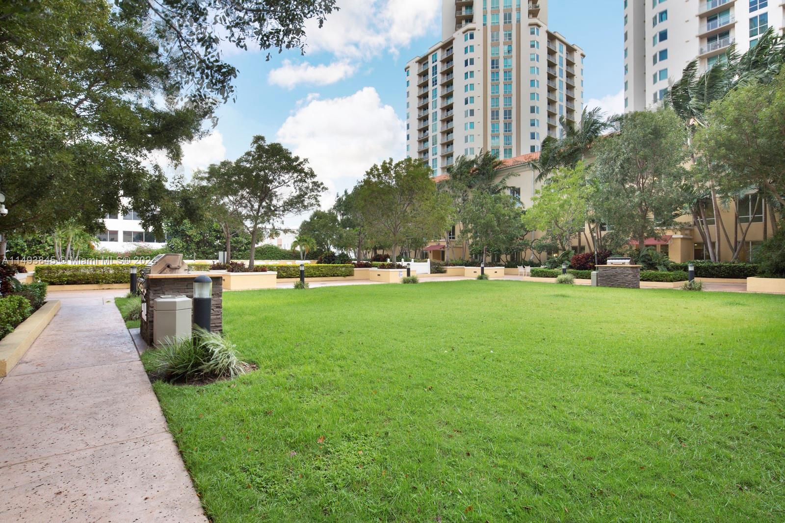 7355 Southwest 89th Street, Unit 510N Miami, FL 33156 - Photo 37 of 52 a park view with tall trees