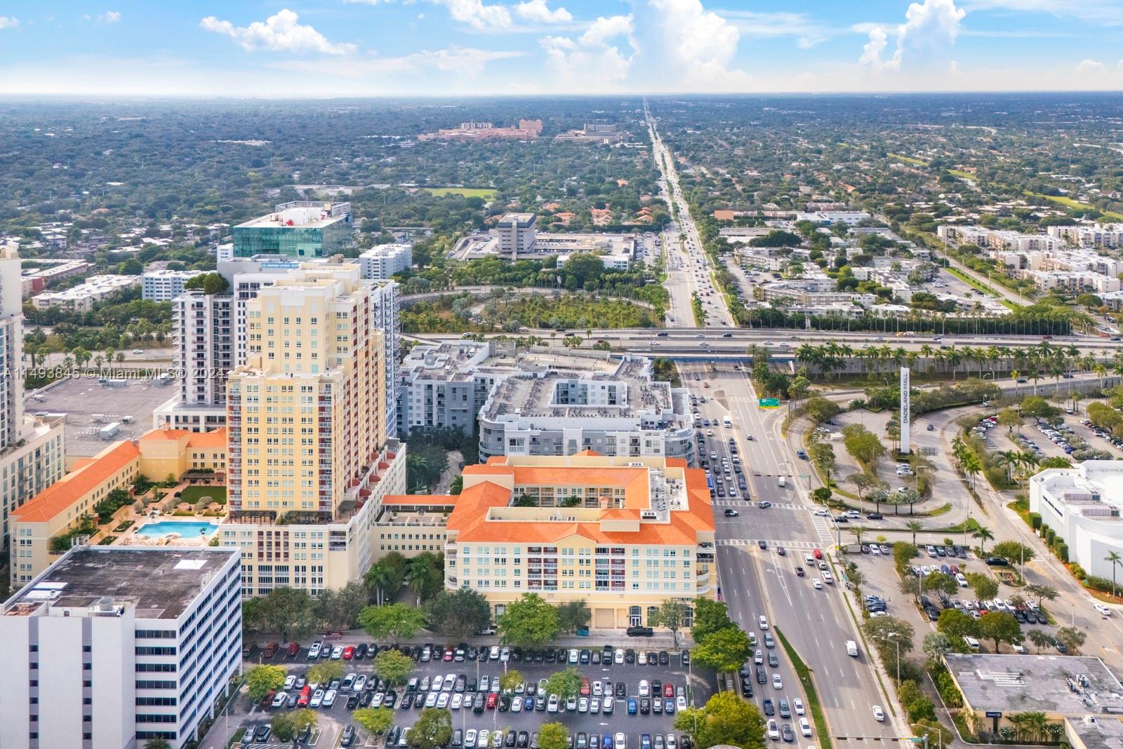 7355 Southwest 89th Street, Unit 510N Miami, FL 33156 - Photo 39 of 52 an aerial view of residential building and lake