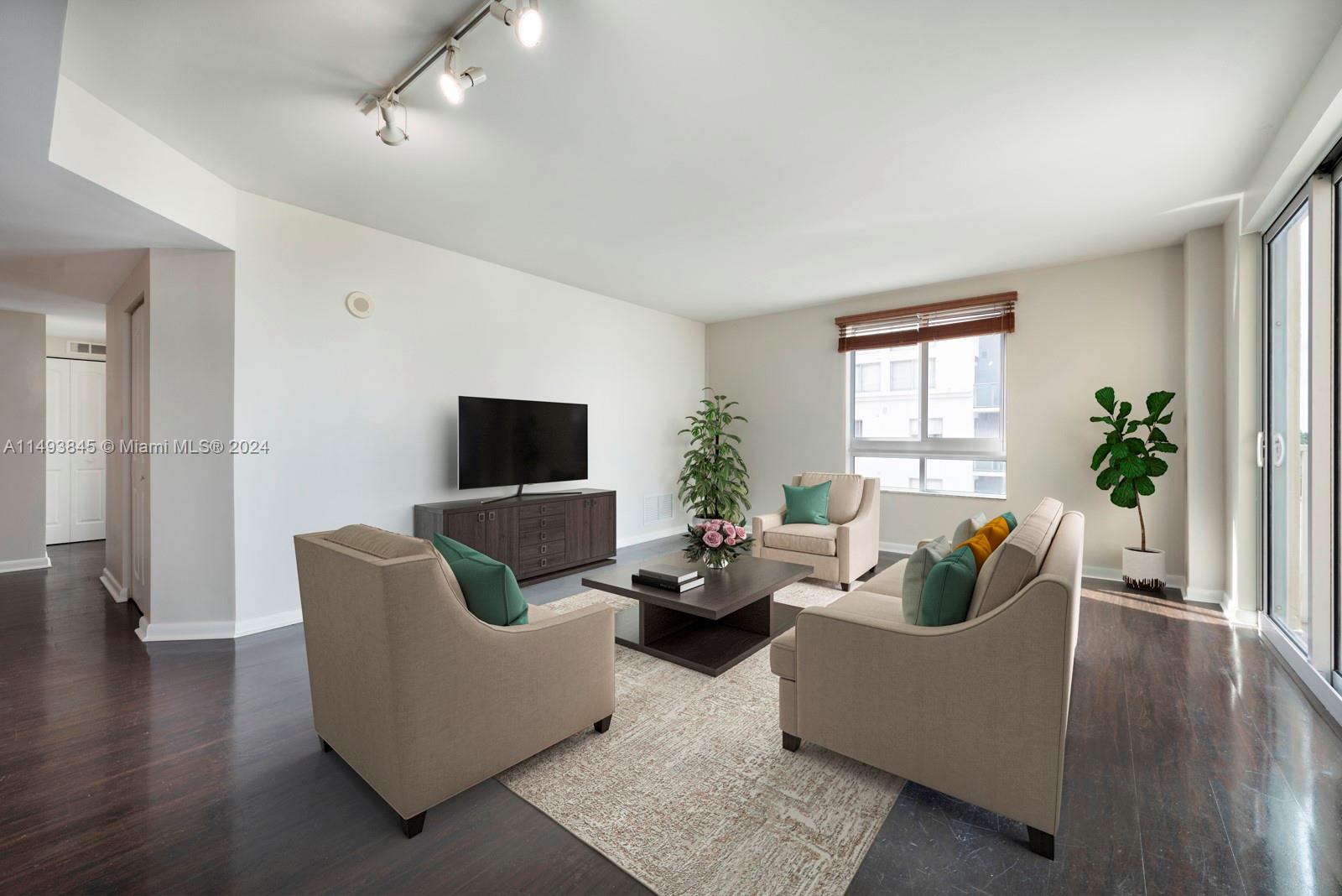 7355 Southwest 89th Street, Unit 510N Miami, FL 33156 - Photo 5 of 52 a living room with furniture wooden floor and a potted plant