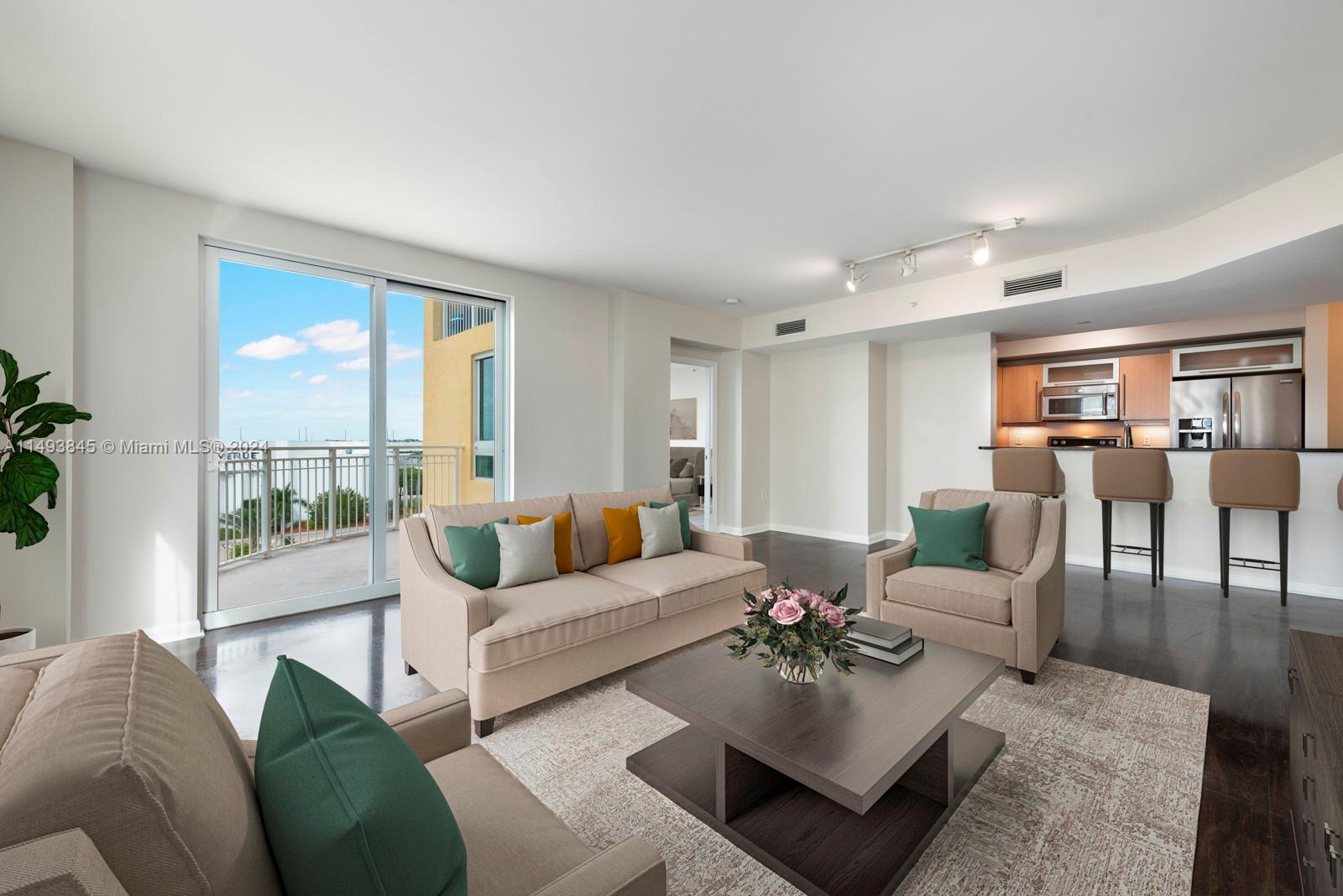 7355 Southwest 89th Street, Unit 510N Miami, FL 33156 - Photo 6 of 52 a living room with furniture and a large window
