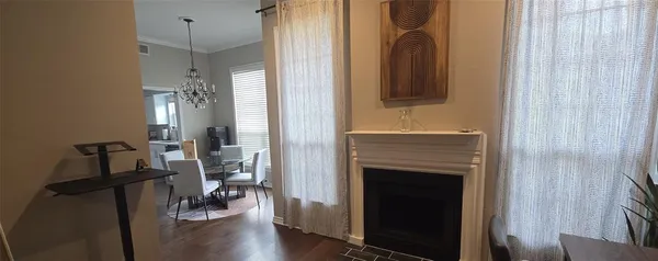 a view of a livingroom with furniture and a fireplace