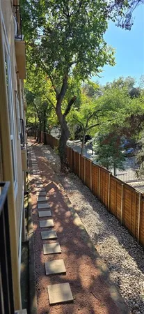 a view of a backyard with trees