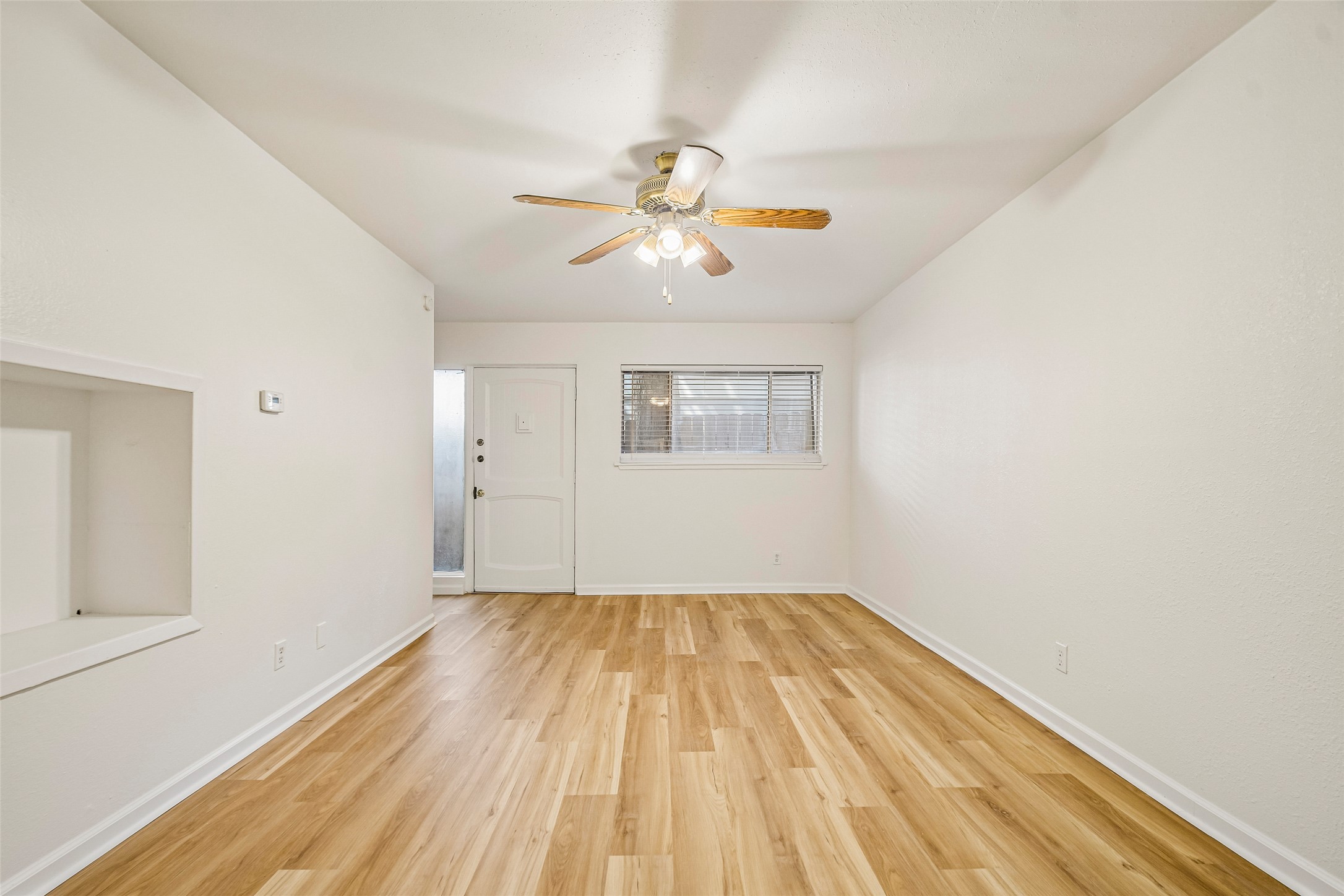 2413 Leon Street, Unit 104 Austin, TX 78705 - Photo 5 of 26 a view of empty room with wooden floor
