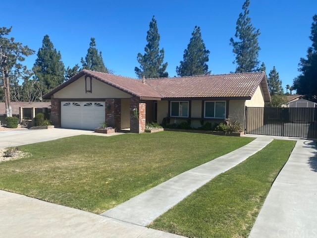 1144 Versailles Circle Riverside, CA 92506 - Photo 1 of 1 a front view of a house with a yard