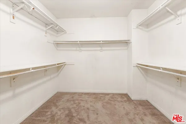 a view of an empty walk in closet