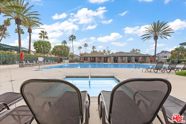 a view of swimming pool with outdoor seating