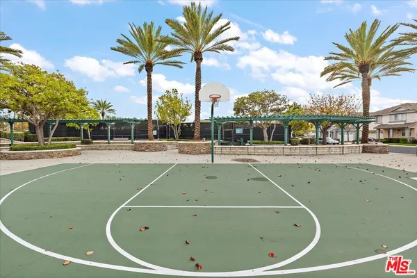 a view of a house with backyard porch and sitting area