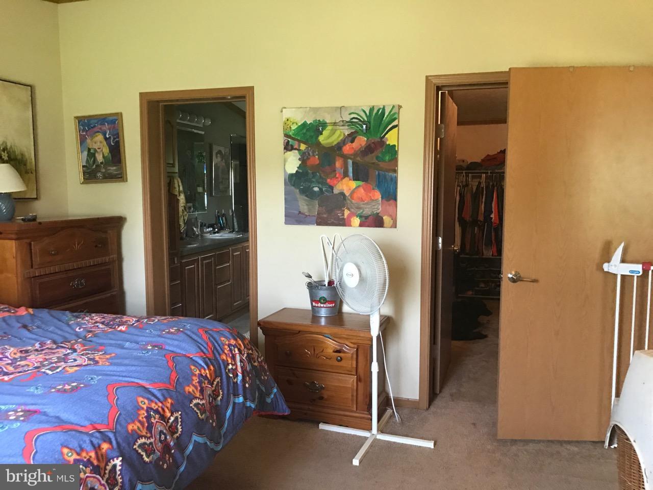 25795 Garey Road Denton, MD 21629 - Photo 14 of 22 a bedroom with a bed and a dresser