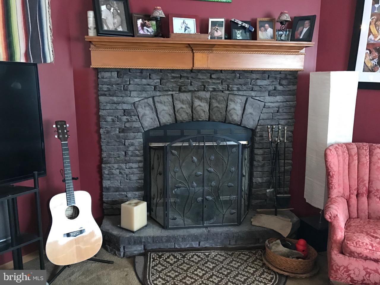 25795 Garey Road Denton, MD 21629 - Photo 8 of 22 a room with furniture and a fireplace