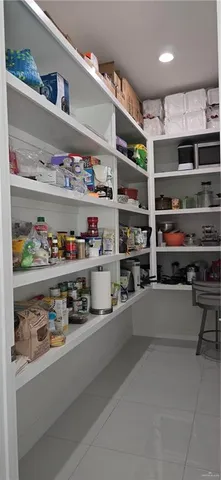 a kitchen with stainless steel appliances a refrigerator and wooden floor