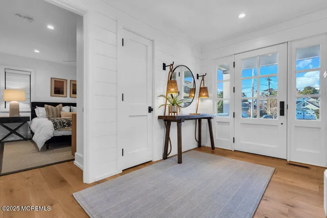 a view of living room and bedroom with furniture