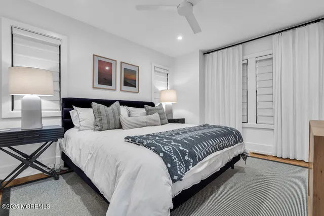 a spacious bedroom with a bed and window