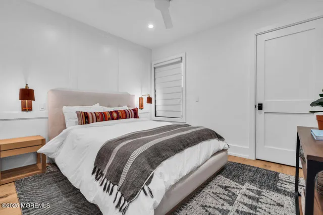 a bedroom with bed and a window