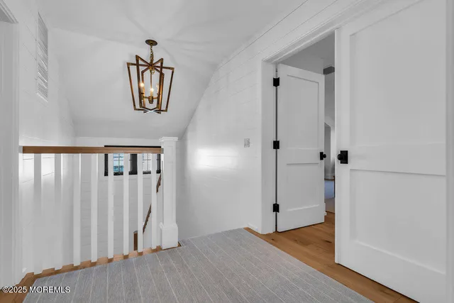 wooden floor with white cabinet